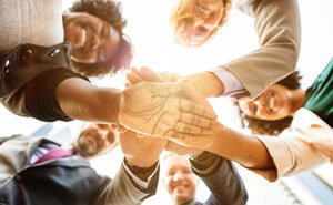 a team joining hands