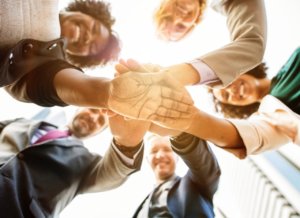 a team joining hands
